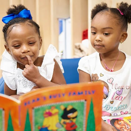 Two young children reading