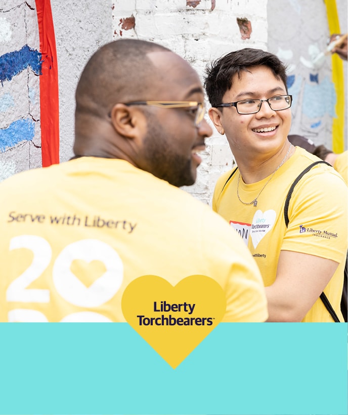 Two Liberty employees outdoors volunteering