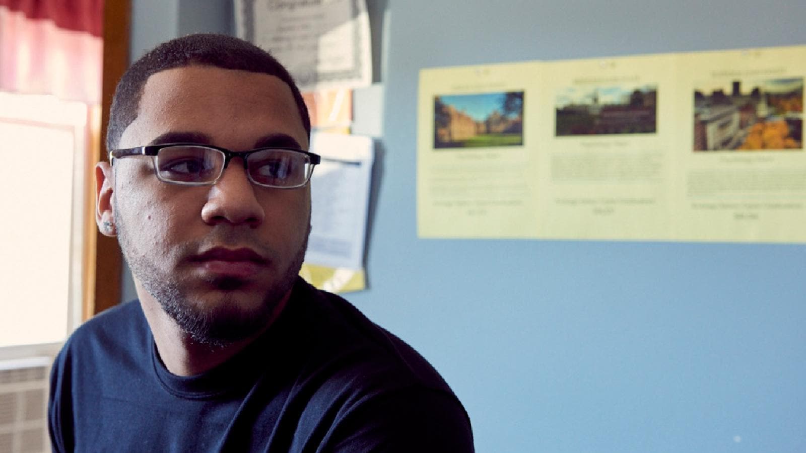 Young man with glasses from Bridge Over Troubled Waters nonprofit 