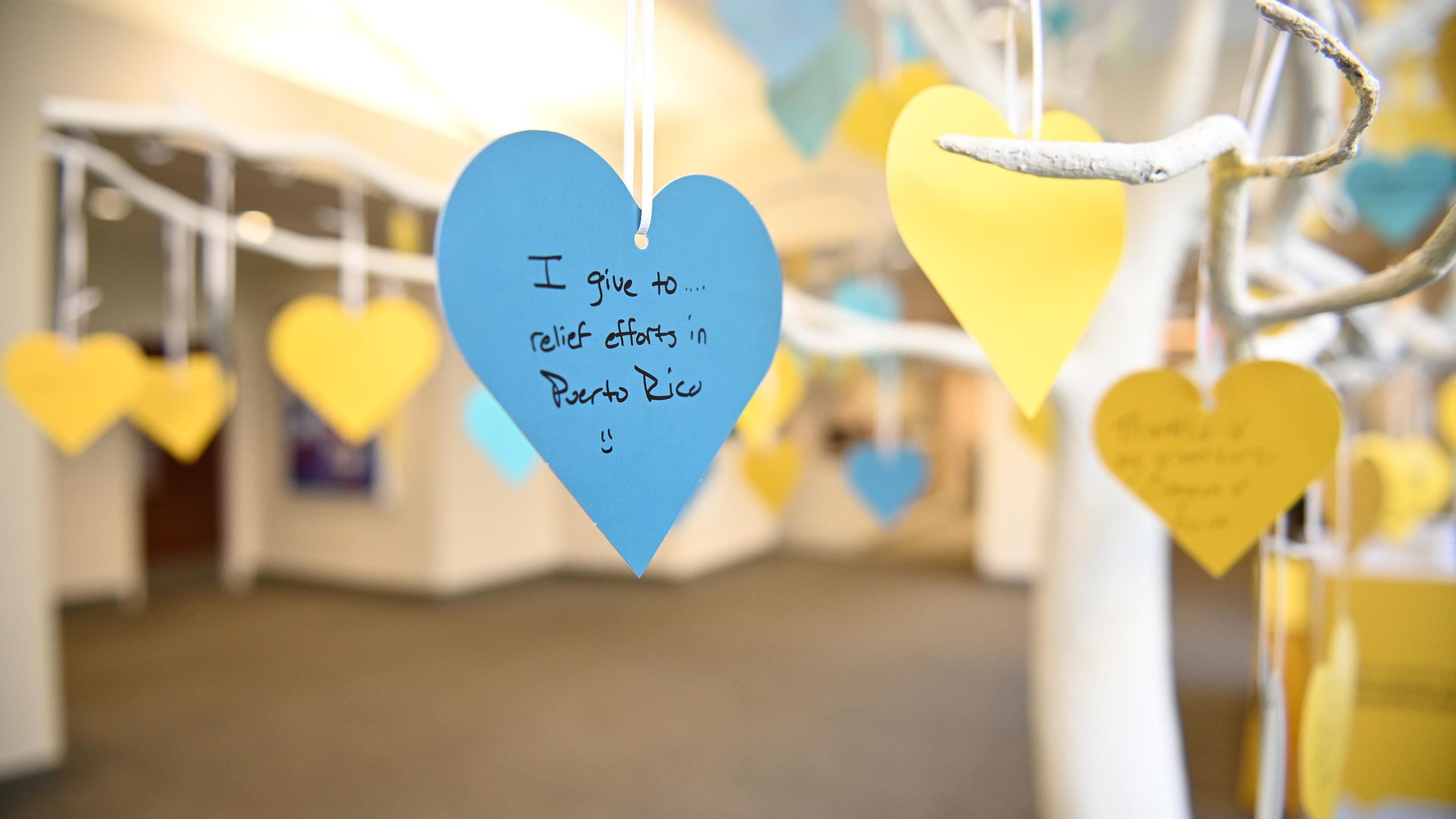 (slide 3 of 5) Paper heart hanging on Give with Liberty tree. 