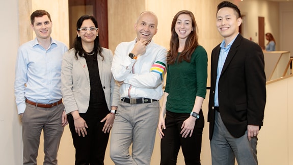 (slide 2 of 4) Liberty Mutual Corporate Research and Strategy team posing for a photo.. 
