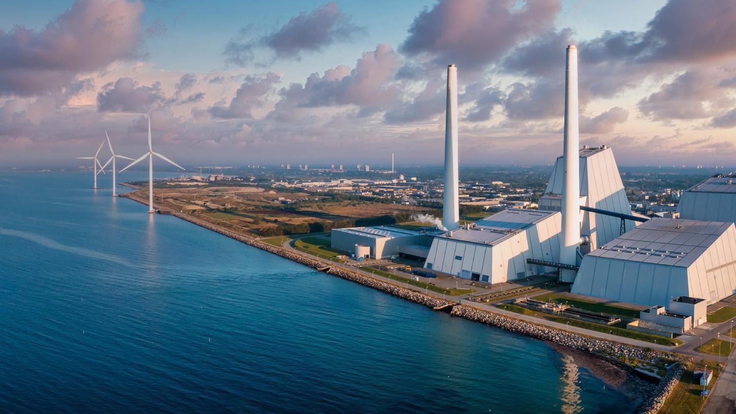 An image of a clean energy plant with turbines 