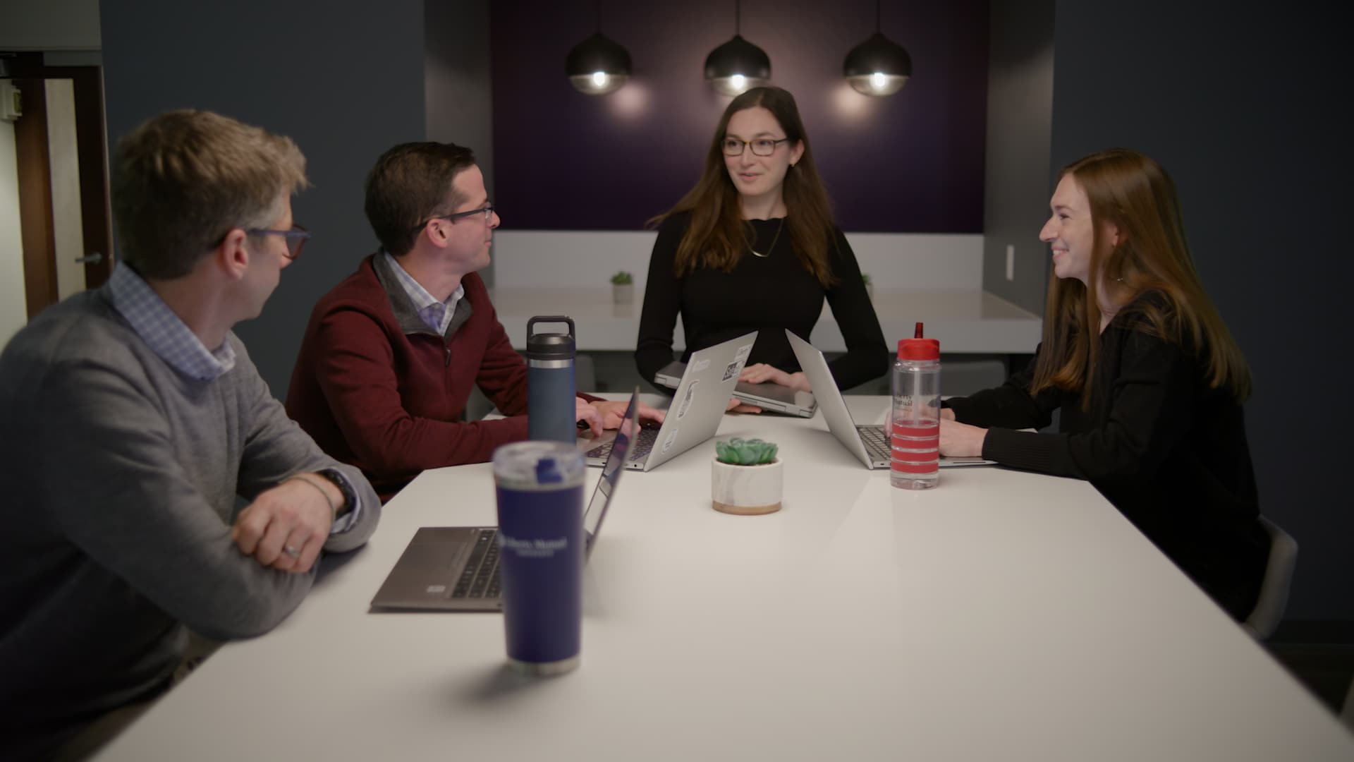 Group of colleagues meeting around a conference table