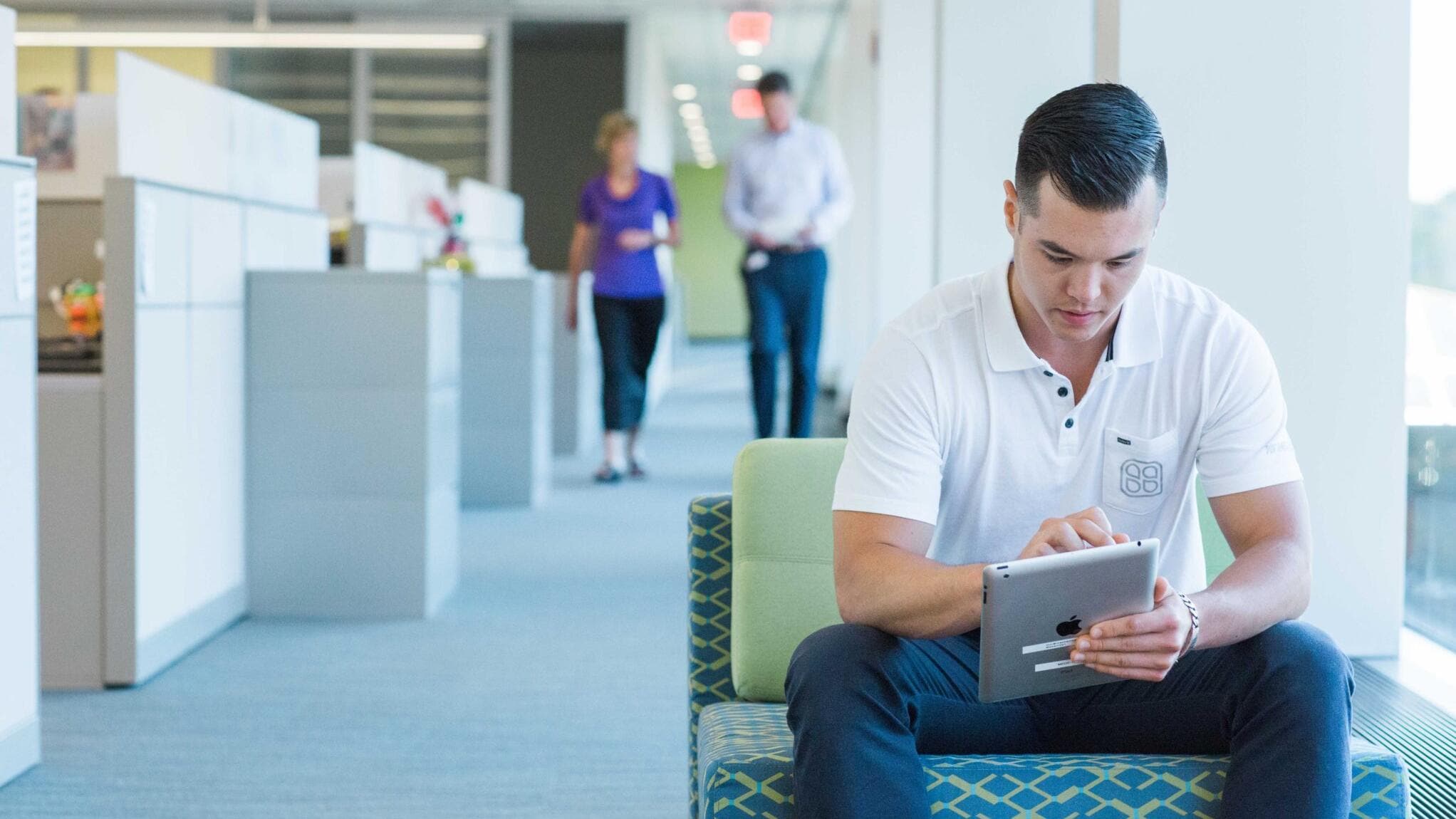A liberty employee doing work on a tablet