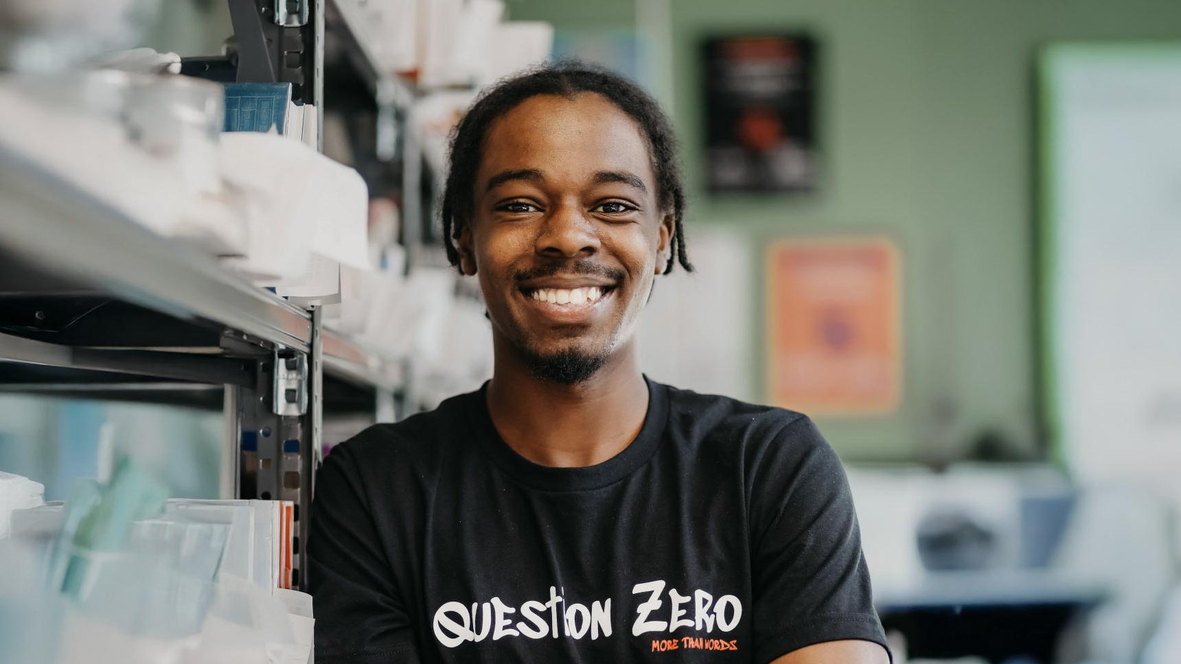 A young man smiling to camera at More than Words
