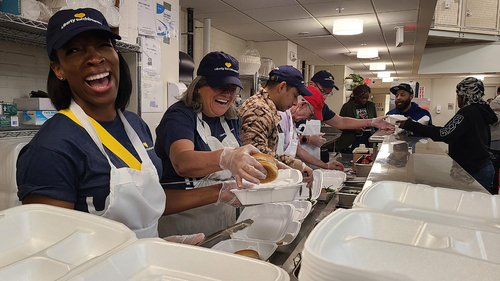 (slide 5 of 5) Group photo of LM Employees volunteering as part of Serve with Liberty. 