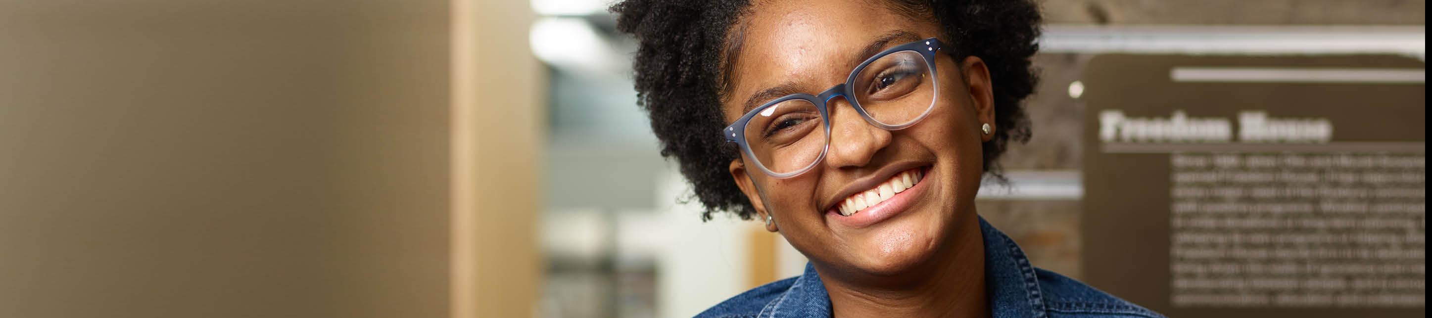 Image of young student smiling, at Freedom House