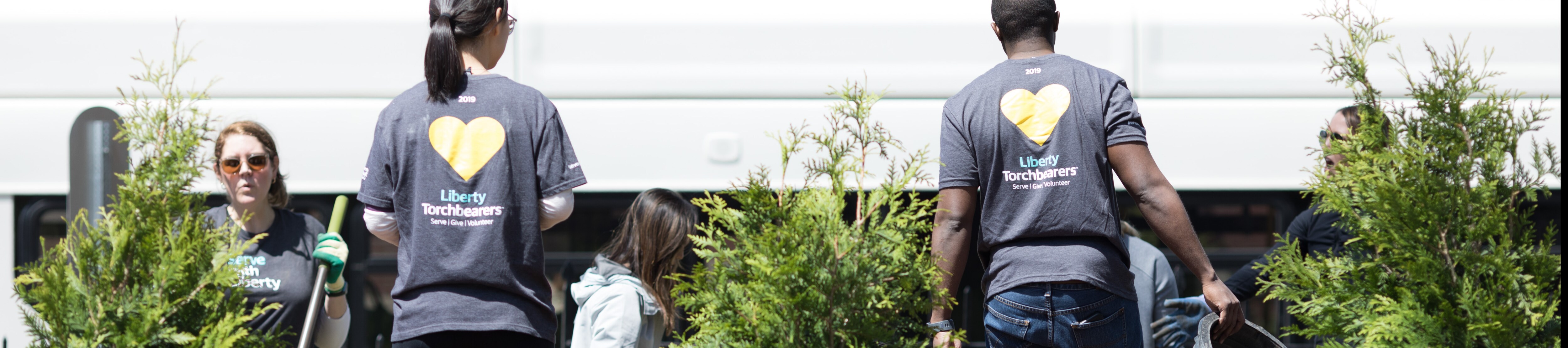 Liberty Mutual employees participating in Serve with Liberty Service day - gardening outdoors