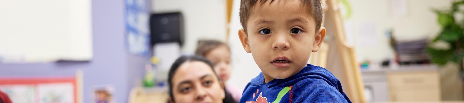 Young child looking to camera